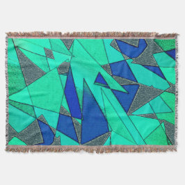 Grüne dreieckige Ausschnitte auf blauem Hintergrun Decke