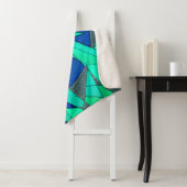 Grüne dreieckige Ausschnitte auf blauem Hintergrun Sherpadecke (Beispiel)