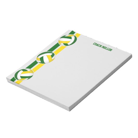 Grüne Goldmannschaft färbt Volleyballtrainer Notizblock (Rotiert)