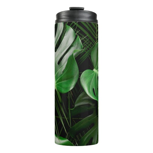 Grüne Monstera-Blätter und Blätter aus Palmen Thermosbecher (Vorderseite)
