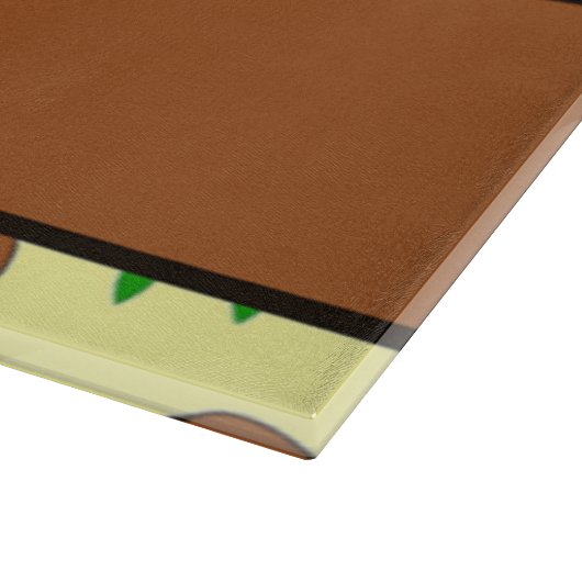 Grüne Pflanze aus Terrakotta auf gelb Schneidebrett (Ecke)