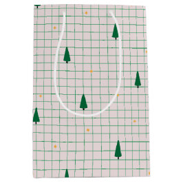 Grüne Plätze mit Weihnachtsbäumen auf Weiß Mittlere Geschenktüte