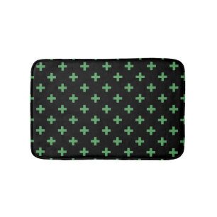 Grüne Polka kreuzt schwarz Badematte