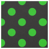 Grüne Polka-Punkte aus schwarzem Hintergrund Stoff (Nahaufnahme)