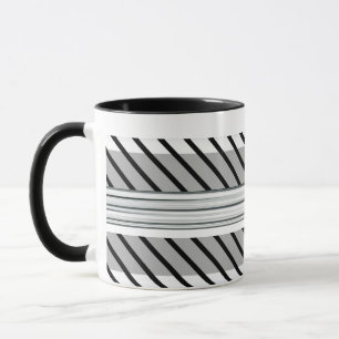 Grüne, schwarze und grau gestreifte Tasse