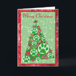 Grüne Tierpfade Silhouette Weihnachtsbaumdekor Karte<br><div class="desc">Frohe Weihnachten moderne abstrakte Baum mit grünen Tierpaw Silhouette baubles. Tierliebhaber Feriendekoration in Rot,  Grün und Weiß. Fröhliche Weihnachtsstimmung an der Vorderseite kann auf alles geändert werden,  was Ihnen gefällt. Sie können sogar Liebe hinzufügen,  und Sie und Ihre Begleithamen unter der Stimmung in der Festkarte.</div>