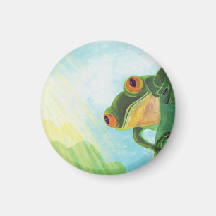 Grüner Frosch, der Sonnenstrahlen fängt Magnet