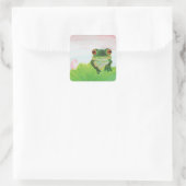 Grüner Frosch hinter dem Aufkleber des Lilenpolste (Tasche)