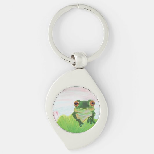 Grüner Frosch hinter dem Schlüsselanhänger des Lil (Vorderseite)