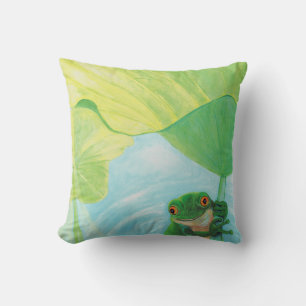 Grüner Frosch unter Lily Pad Kissen
