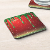 Grüner Glitter-Tropfen über rotem Hintergrund Getränkeuntersetzer (Linke Seite)