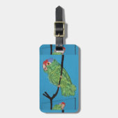 grüner Papagei auf blauem Gepäckanhänger (Vorderseite vertikal)