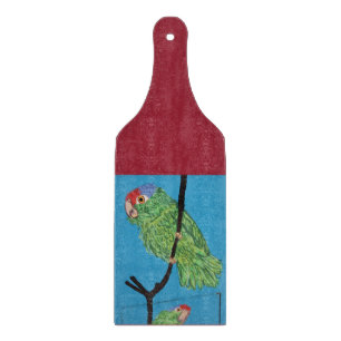 grüner Papagei auf rot/blau Schnittpappe Schneidebrett