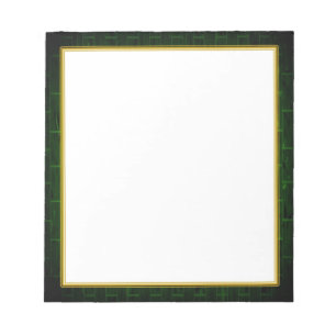 Grüner Ziegelstein auf weißem kleinem Notizblock