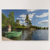 Grünes Boot in einer Fjordlandschaft in Norwegen Puzzle (Horizontal)
