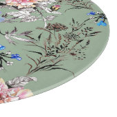 Grünes Hintergrund Blumenmuster. Schneidebrett (Ecke)