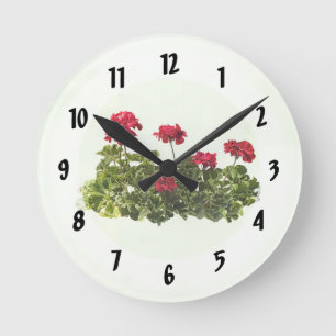 Gruppe roter Geranien Runde Wanduhr