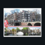Grüße aus Holland - Amsterdam Postcard Postkarte<br><div class="desc">Grüße aus Holland - Amsterdam Postcard. Eine Postkarte aus dem Amsterdamer Stadtbild mit wunderschönen Fotos der Amsterdamer Kanäle, Häusern und Brücken und dem Text "Grüße aus Holland" mit rosa Tulpen, der niederländischen Nationalflagge und dem Text "Amsterdam". Diese großartige Amsterdamer Karte ist vollständig anpassbar, fügen Sie Ihre Texte und Bilder! Ein...</div>