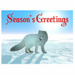 Grüße der Saison - Arktischer Fuchs Fotoskulptur Magnet<br><div class="desc">Weiß auf Weiß. Ein digitales Bild eines arktischen Fox, Vulpes lagopus, auf dem Polareis. Die Sonne hängt tief im hellblauen arktischen Himmel. Nicht an der Sonne starren, da es Ihren Augen schaden kann. Text liest, "Die Grüße der Jahreszeit" erscheint in rot. Der Arktische Fox ist in tiefer Kälte bequem; er...</div>