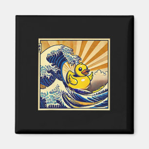 Gummi-Ente surft auf einer Welle Magnet