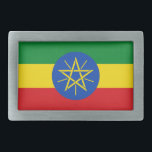 Gürtelschnalle mit Flagge in Äthiopien<br><div class="desc">Dieses auffällige Gürtelschnalle mit der Flagge von Äthiopien ist ein gewagtes Statement, das jedem Outfit eine patriotische Touch verleiht. Dieses Gürtelschnalle mit dem symbolträchtigen Emblem in der Mitte zeigt die lebhaften Farben Grün, Gelb und Rot und ist perfekt für alle, die auf die reiche Geschichte und Kultur Äthiopiens stolz sind....</div>