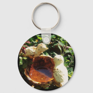 Gusseiserne Vögel im Garten Schlüsselanhänger