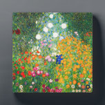 Gustav Klimt Flower Garden Plaque Fotoplatte<br><div class="desc">Gartenplatz von Gustav Klimt. Ölmalerei auf Leinwand aus dem Jahr 1907. Der Blumengarten, der während seiner goldenen Phase fertig gestellt wurde, ist eines der bekanntesten Landschaftsgemälde Klimts. Die Sommerfarben brachen in diesem Werk mit einer wunderschönen Mischung aus orangefarbenen, roten, lila, blauen, rosa und weißen Blüten aus. Ein großartiges Geschenk für...</div>