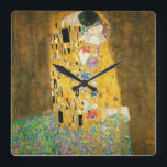 Gustav Klimt The Kiss Quadratische Wanduhr<br><div class="desc">Gustav Klimt Die Vintage Jugendstil-Malerei Der Kuss wurde zwischen 1907 und 1908, dem Höhepunkt seiner Goldenen Periode, vom österreichischen Symbolik-Maler Gustav Klimt gemalt, als er eine Reihe von Werken in einem ähnlich vergoldeten Stil malte. Das Gemälde gilt weithin als Meisterwerk der frühen Moderne. Es ist ein Symbol des Wiener Jugendstils...</div>