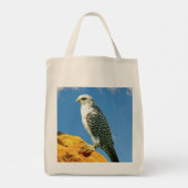 Gyrfalcon steht auf einem Felsen Tragetasche (Rückseite)