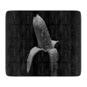 Halb geschältes Bananenschwarz-weißes Portrait Schneidebrett