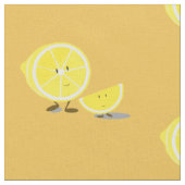 Halbe Zitrone und lächelnde Zitronenscheibe Stoff (Nahaufnahme)