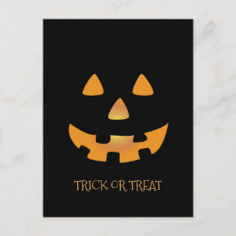 Halloween Kürbisgesicht auf schwarzem Hintergrund Postkarte