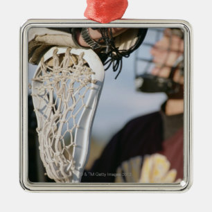 Hand auf einem Lacrosse-Stock Ornament Aus Metall