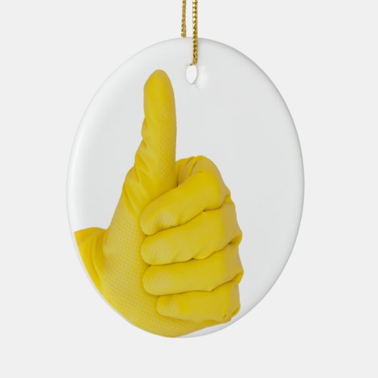 Hand in gelbem Latex Handschuh Keramikornament (Rechts)