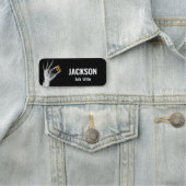 Hand mit einem Radiationssymbol Namensschild (Beispiel)