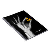 Hand mit einem Radiationssymbol Notizblock (Rechte Seite)
