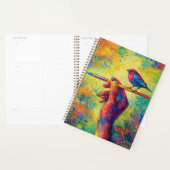 Hand mit Pinsel und kreativem Vogel Planer (Anzeige)