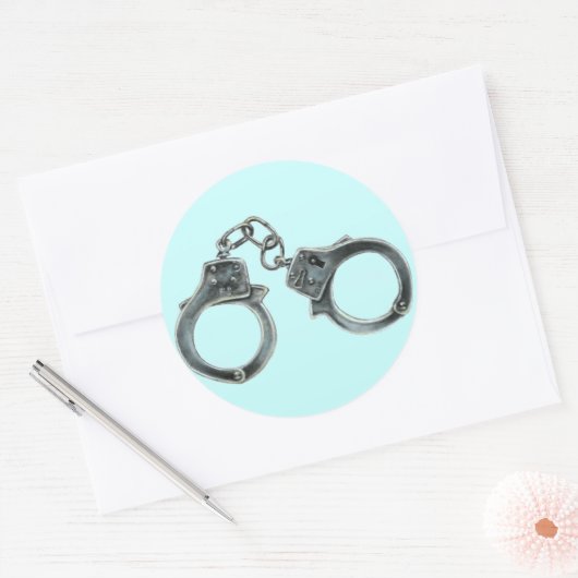 HANDCUFFS RUNDER AUFKLEBER (Umschlag)