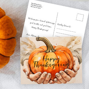 Hände im Wasser Halten eines Pumpkin-Erntedanks Postkarte