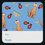 Hanukkah Cat Dreidel Blue Aufkleber<br><div class="desc">Liebhaber von Katzen werden begeistert sein von diesem lustigen,  skurrilen "Hanukkat"-Geschenkticker mit einer orangefarbenen,  neugierigen Tabbattkatze,  die eine Kippah,  rote dreiköpfige und gelbe Menorahs/Kanukiahs auf hellblauem Hintergrund trägt. Ideal,  um Ihre Hannukah / Chanukah Geschenke während des jüdischen Festes der Lichter zu verpacken! Personalisieren Sie den Text mit Ihrem Familiennamen.</div>