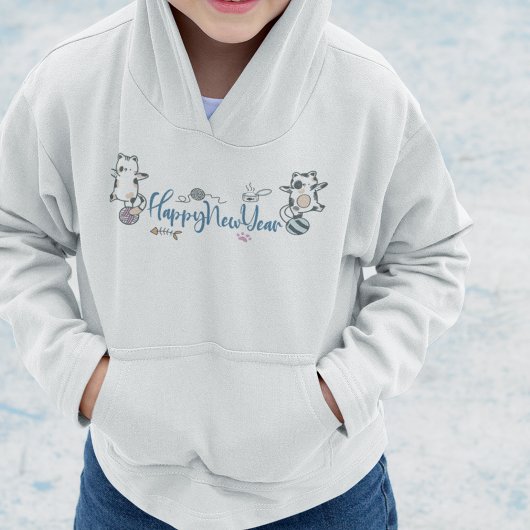 Happy New Year between Kittens Balanced on a Yarn Hoodie