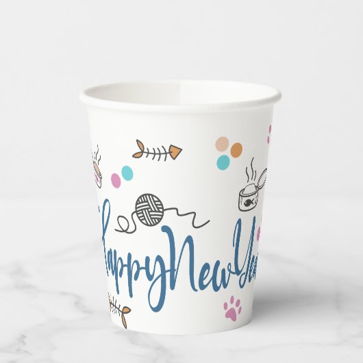 Happy New Year between Kittens Balanced on a Yarn Pappbecher (Links)