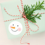 Happy Winter Snowman Face Runder Aufkleber<br><div class="desc">Your friends and family will smile this winter season with these cute custom snowman stickers. Design features a jolly snowman with warm rosy cheeks,  a carrot nose and smile made of coal. Snow white,  black,  pink and orange design colors.</div>