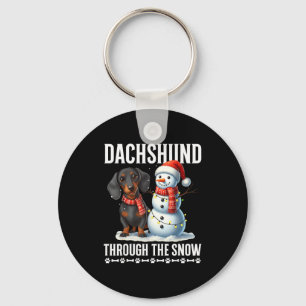 Hässlicher Dachshund Weihnachten durch den Schnee Schlüsselanhänger