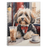 Havanischer Hund trinkt einen Milchshake in einem Notizblock (Vorderseite)