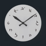 Hebrew Script Lettering Runde Wanduhr<br><div class="desc">The "Hebrew Essentials, " Consumer Marketplace offers a shopping experience as you will not find anywhere else. Our specialty is Hebrew,  and in our store your will find Hebrew in block,  script,  and Rashi script.  Tell your friends about us and send them our link:  http://www.zazzle.com/HebrewNames?rf=238549869542096443*  ENJOY YOUR VISIT!</div>