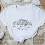 HEIDI Bohemische Wildblume Mama T-Shirt<br><div class="desc">In diesem Shirt finden Sie rauchige Aquarellberge und farbenfrohe Wildblumen mit den Worten "Bergmama",  geschrieben in einem handgeschriebenen boho-Schriftart. Dieses Mama Shirt ist das ideale Geschenk für Ihre Lieblingsfrau,  die eine Mutter erwartet oder arbeitet als eine tolle Schwangerschaftsankündigung.</div>