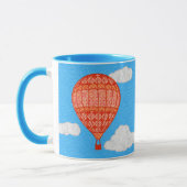 Heißluftballon, Korallenorange gegen einen blauen Tasse (Links)