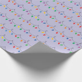 Helle, farbenfrohe Weihnachtslichter leuchten naht Geschenkpapier (Ecke)