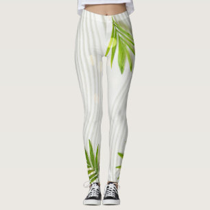 Helle, grüne Blätter auf pristischem weißem Hinter Leggings